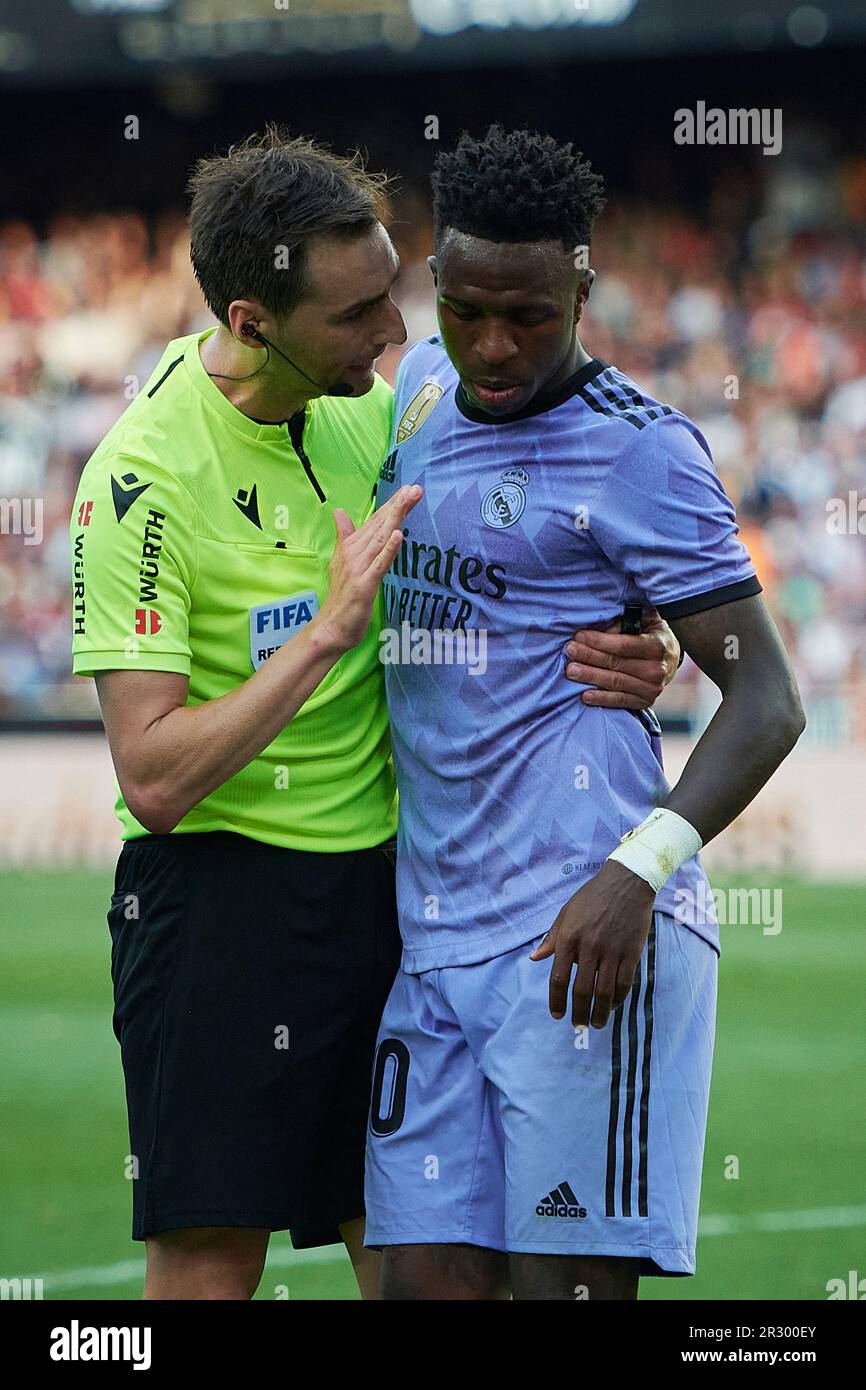 Valencia, Spain. 21st May, 2023. Referee Ricardo De Burgos Bengoetxea speaks to Real Madrid's Vinicius Jr. (R) during the Spanish La Liga football match between Valencia CF and Real Madrid in Valencia, Spain, May 21, 2023. Credit: Str/Xinhua/Alamy Live News Stock Photo
