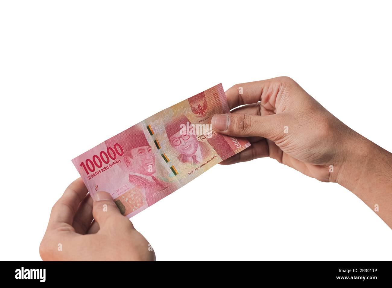 Hand holding one hundred thousand rupiah banknote isolated on a white background. financial concept Stock Photo