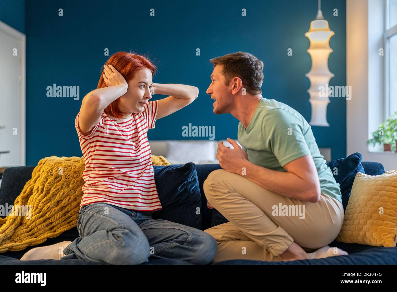Angry annoyed man husband screaming at wife Stock Photo - Alamy