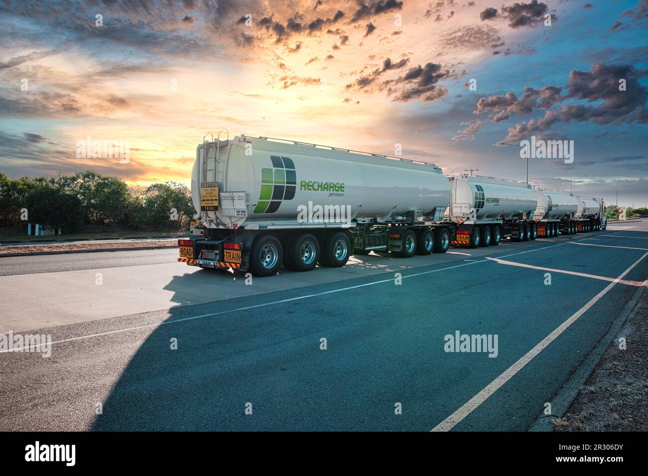 long Australian road train checking weight at weigh station before