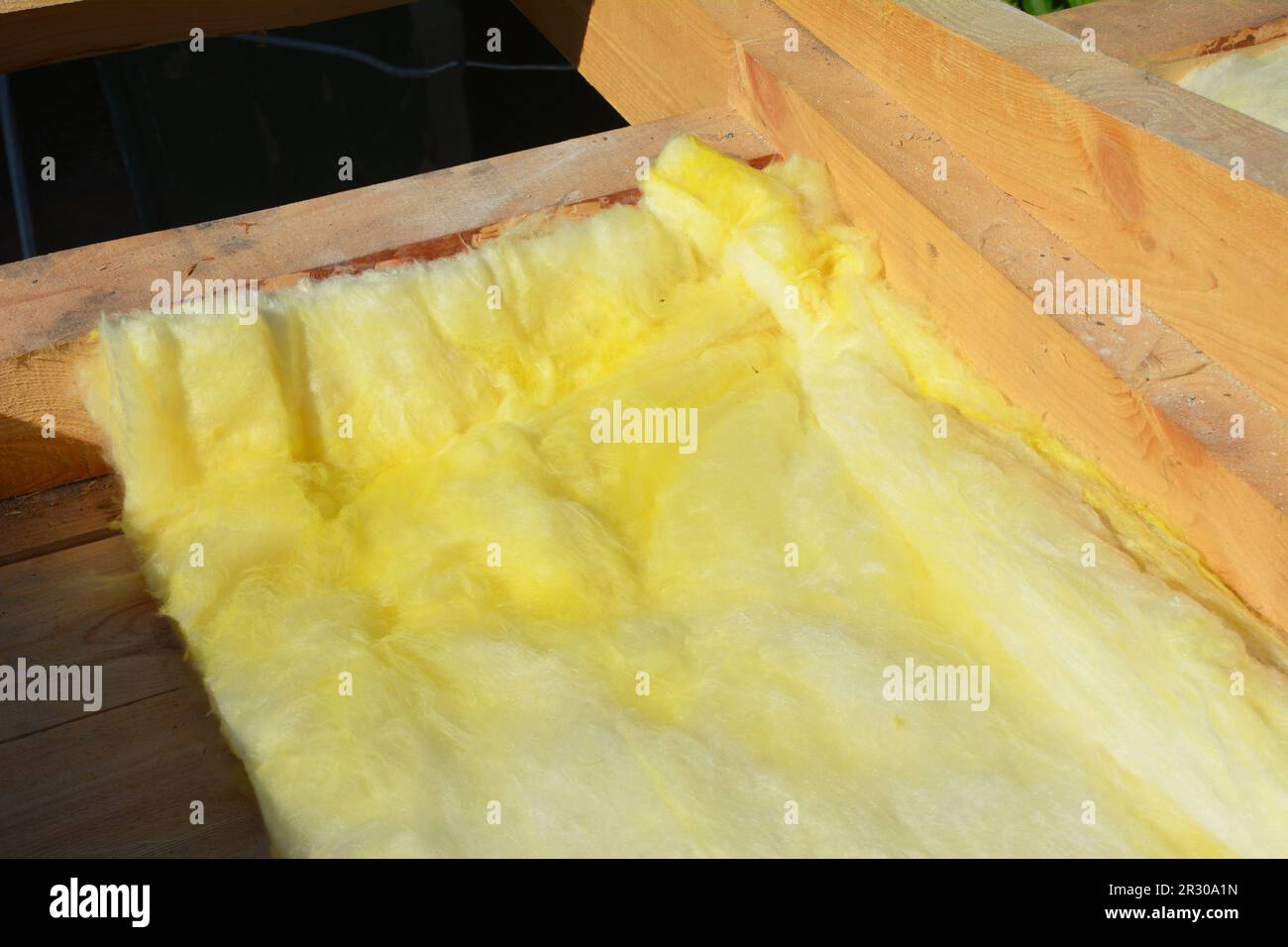 Close up on house roof insulation with mineral wool, fiberglass under