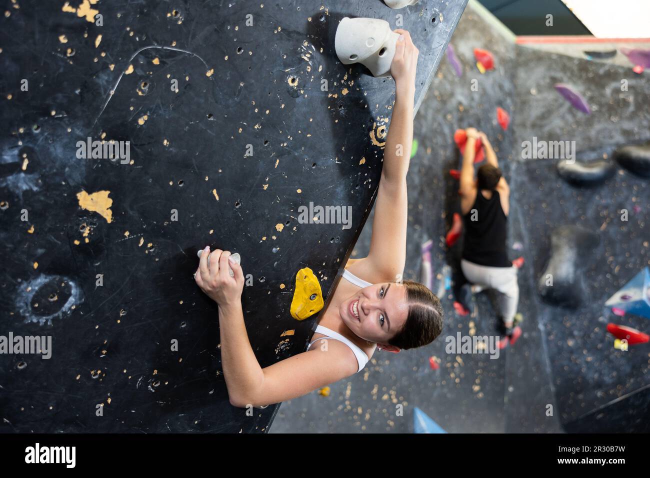 Female fitness climber training at bouldering gym Stock Photo Alamy