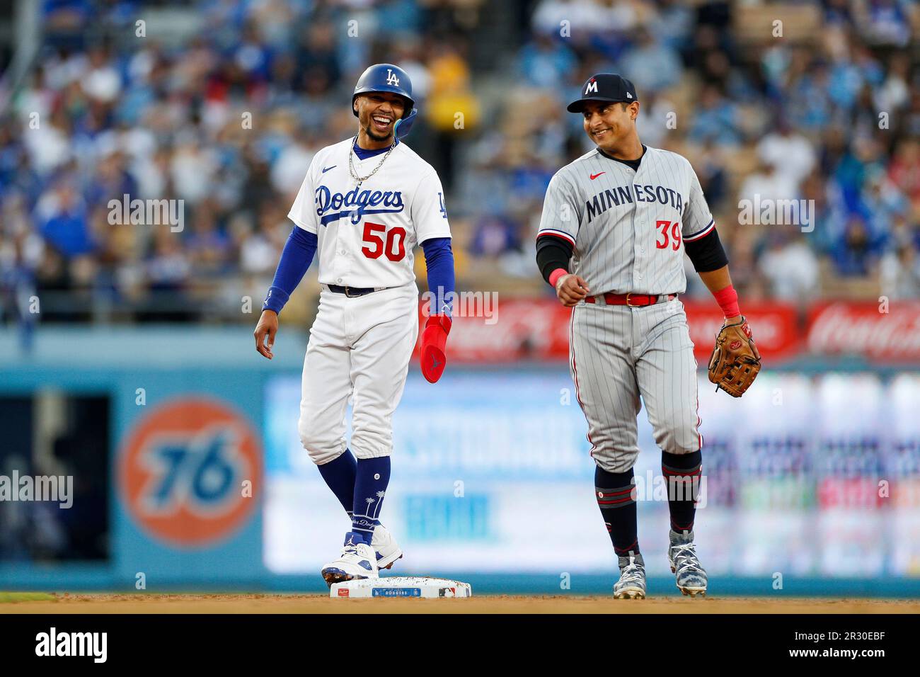LOS ANGELES, CA - MAY 16: Los Angeles Dodgers second basemen Mookie Betts  (50) smiles while talking with Minnesota Twins second baseman Donovan Solano  (39) during a regular season game on May