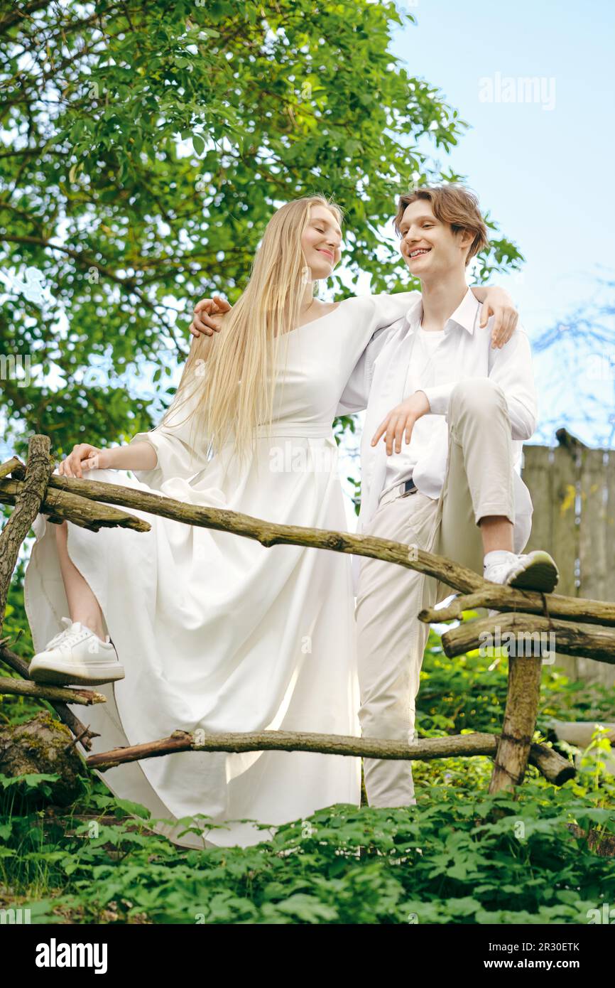 Happy young couple in love hug each other outdoors Stock Photo - Alamy