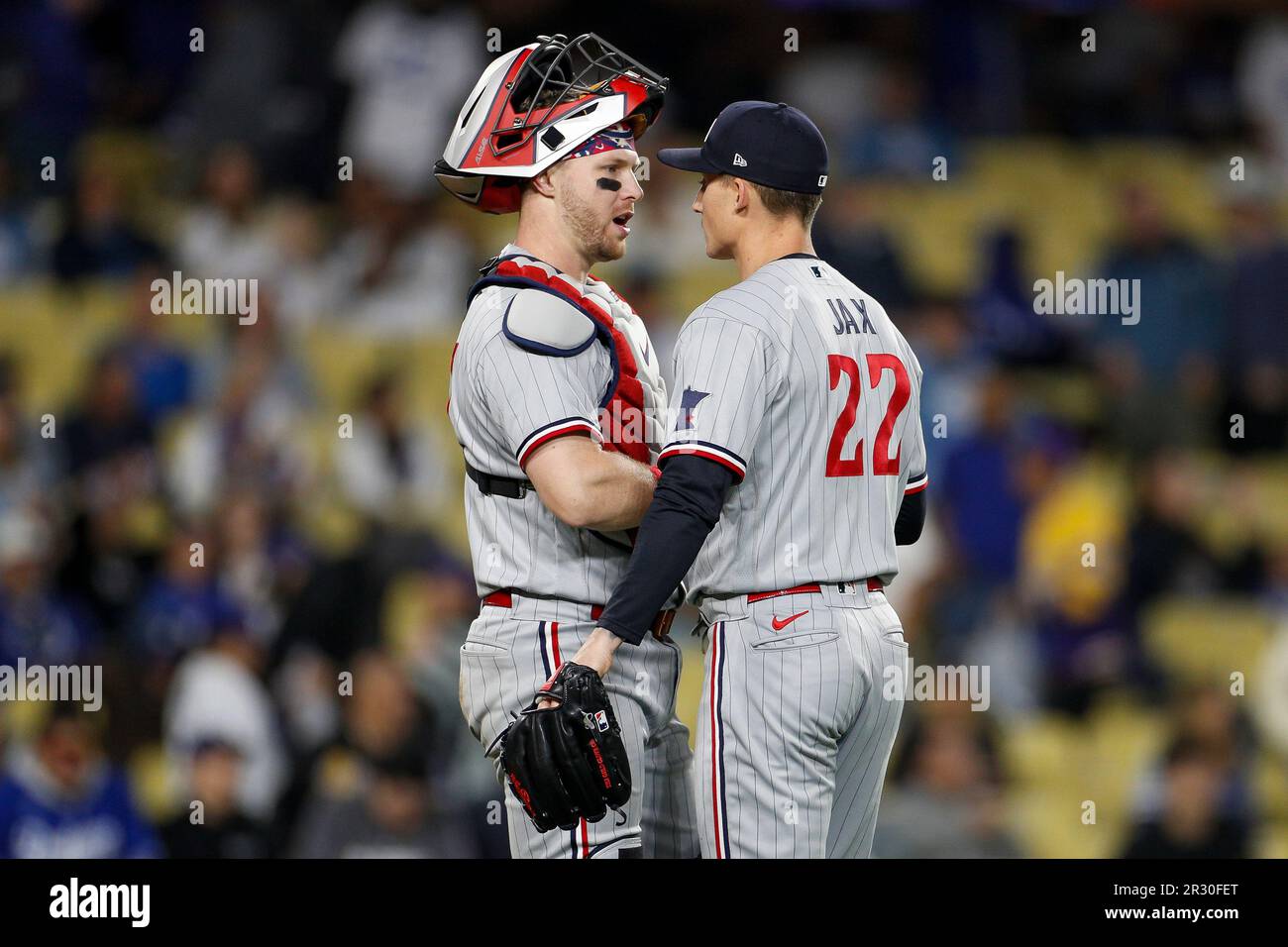 LOS ANGELES, CA - MAY 17: Minnesota Twins catcher Ryan Jeffers (27)  congratulates relief pitcher Griffin Jax (22) after their team victory in a  regular season game over the Los Angeles Dodgers