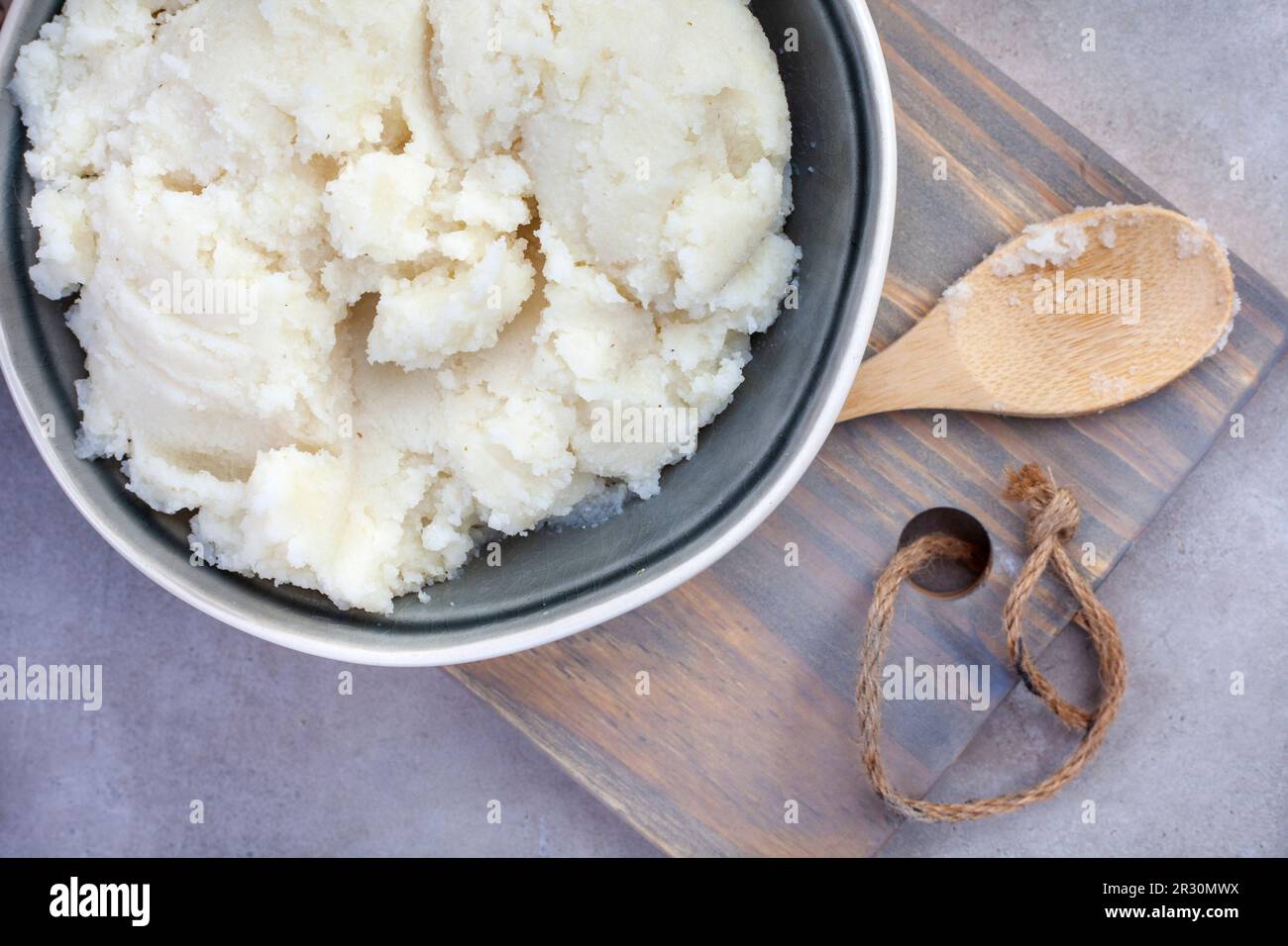 Traditional South African pap or maize meal on mottled grey Stock Photo