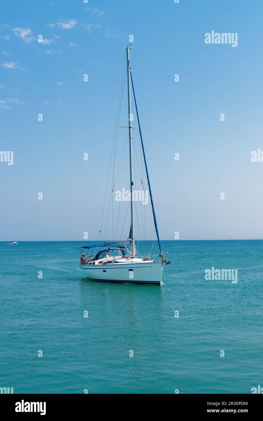 Small yacht sailing in a sea Stock Photo Alamy