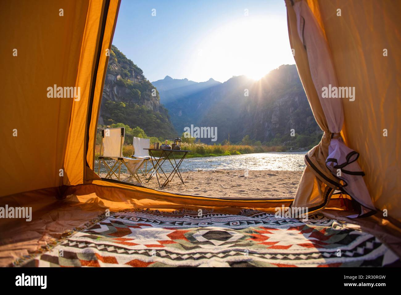 Camping tent by the river Stock Photo - Alamy