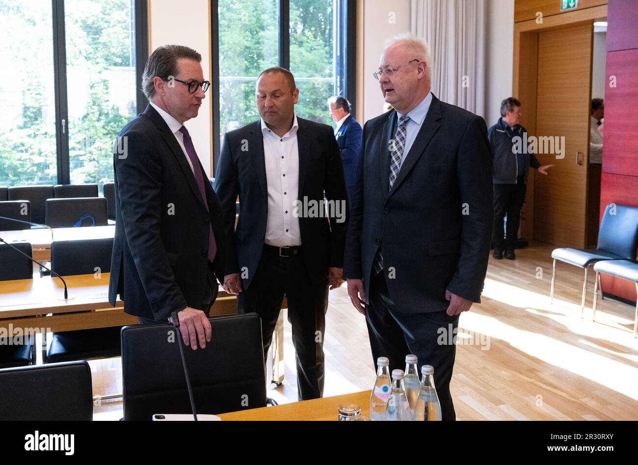 22 May 2023, Bavaria, Munich: Andreas Scheuer (l-r, CSU), former Federal Minister of Transport, Jürgen Baumgärtner, CSU Member of the State Parliament and Deputy Chairman of the Investigation Committee, and Bernhard Pohl, Deputy Parliamentary Group Chairman of the Free Voters and Chairman of the Investigation Committee for the Main Line, stand in the conference room of the Bavarian State Parliament before the start of the Investigation Committee for the Main Line. Scheuer has to testify as a witness in the committee of inquiry on the second Munich S-Bahn main line. Photo: Sven Hoppe/dpa Stock Photo