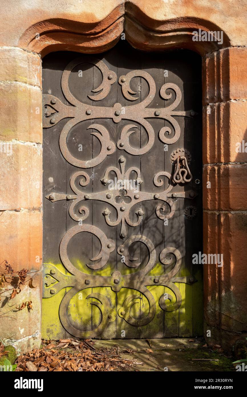 Elaborate hinges on a 17th century door to St Wilfred Chapel, Brougham Hall, Penrith, Cumbria, UK Stock Photo