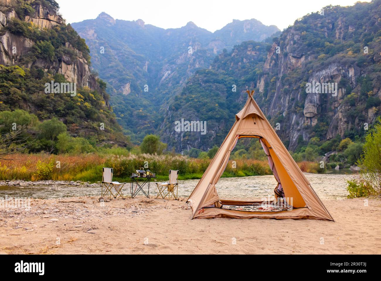 Camping tent by the river Stock Photo - Alamy
