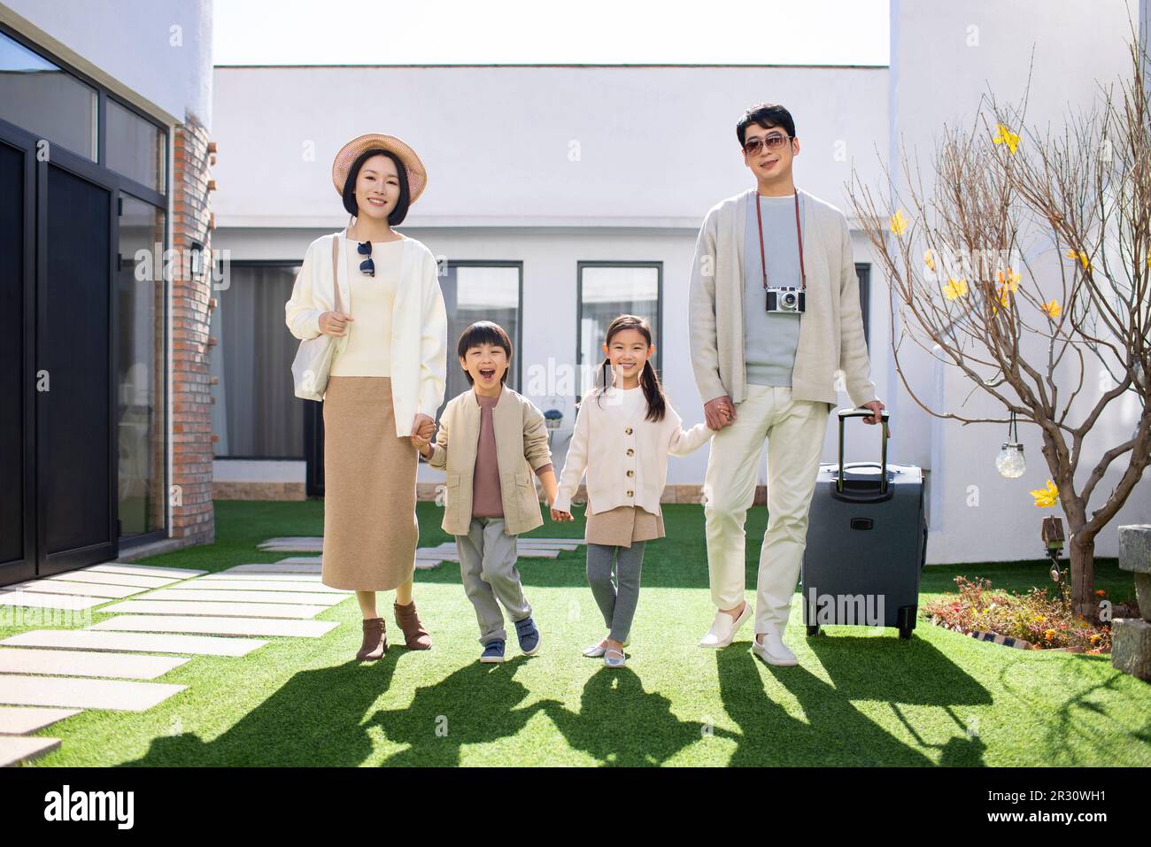Happy young Chinese family on vacation Stock Photo - Alamy