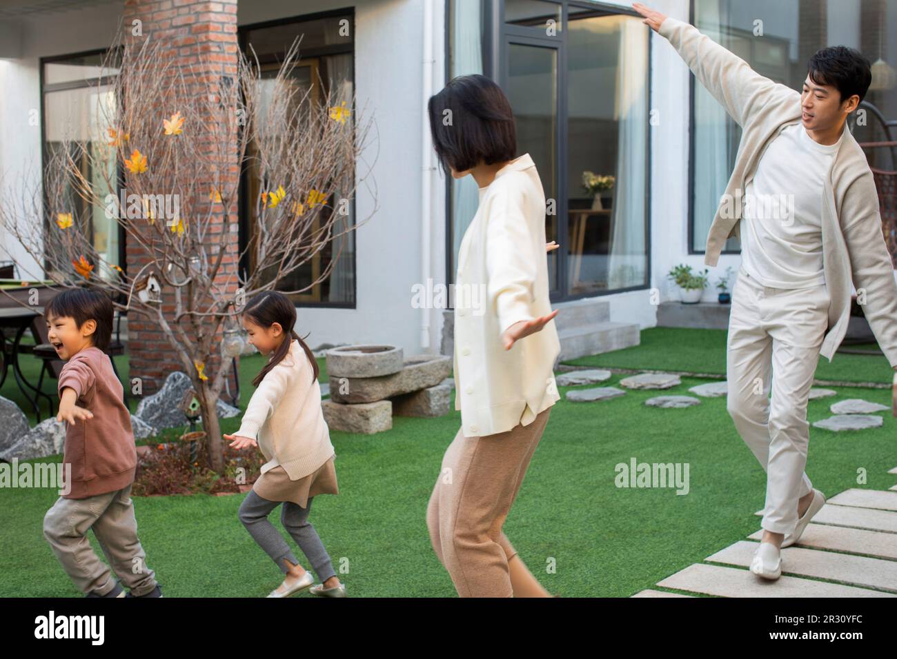 Happy Young Chinese Family Playing In The Courtyard Stock Photo Alamy happy-young-chinese-family-playing-in-the-courtyard-stock-photo-alamy