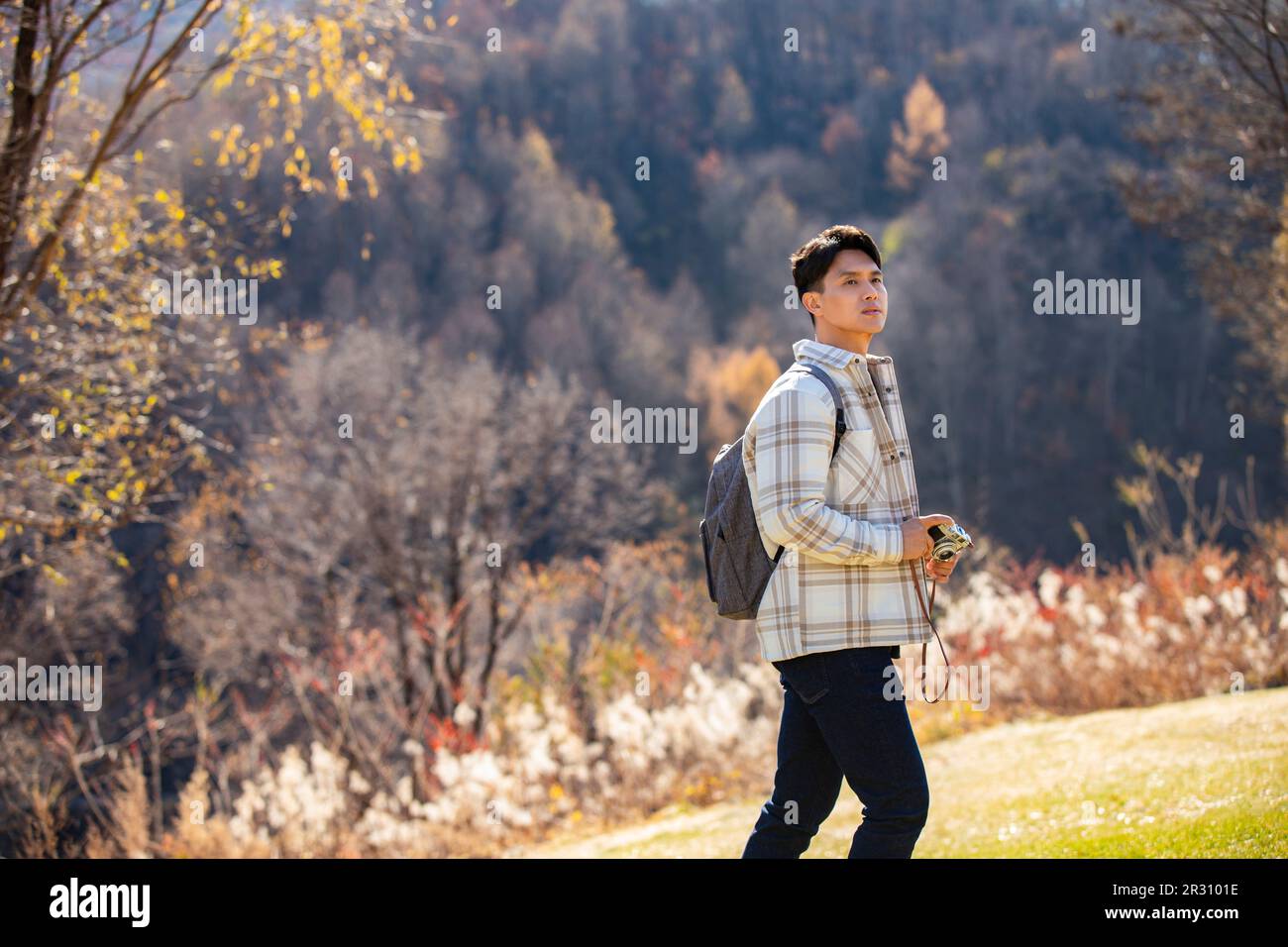 Young man taking photos outdoors Stock Photo