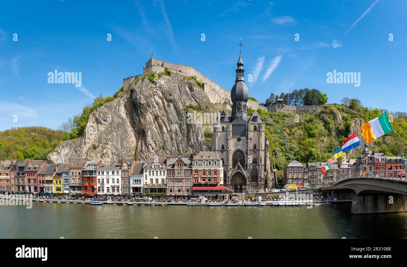 Dinant, Belgium, 04.05.2023, Panorama of Dinant on the shores of the Meuse river with famous citadel and gothic collegiate church Stock Photo