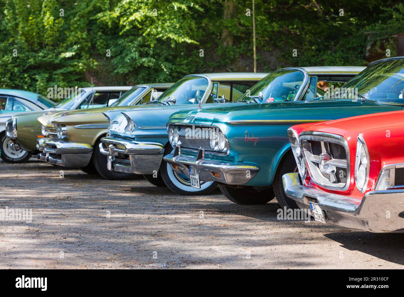 Stade, Germany – May 13, 2023: View along the front grills of some vintage Chrysler, Plymouth, Dodge and Desoto cars at Spring Fling, an annual meetin Stock Photo