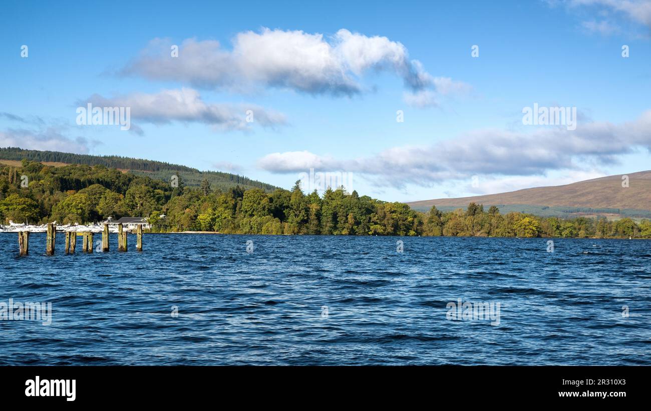 Loch Lomond on a summer day. View across the blue lake to the Scottish ...