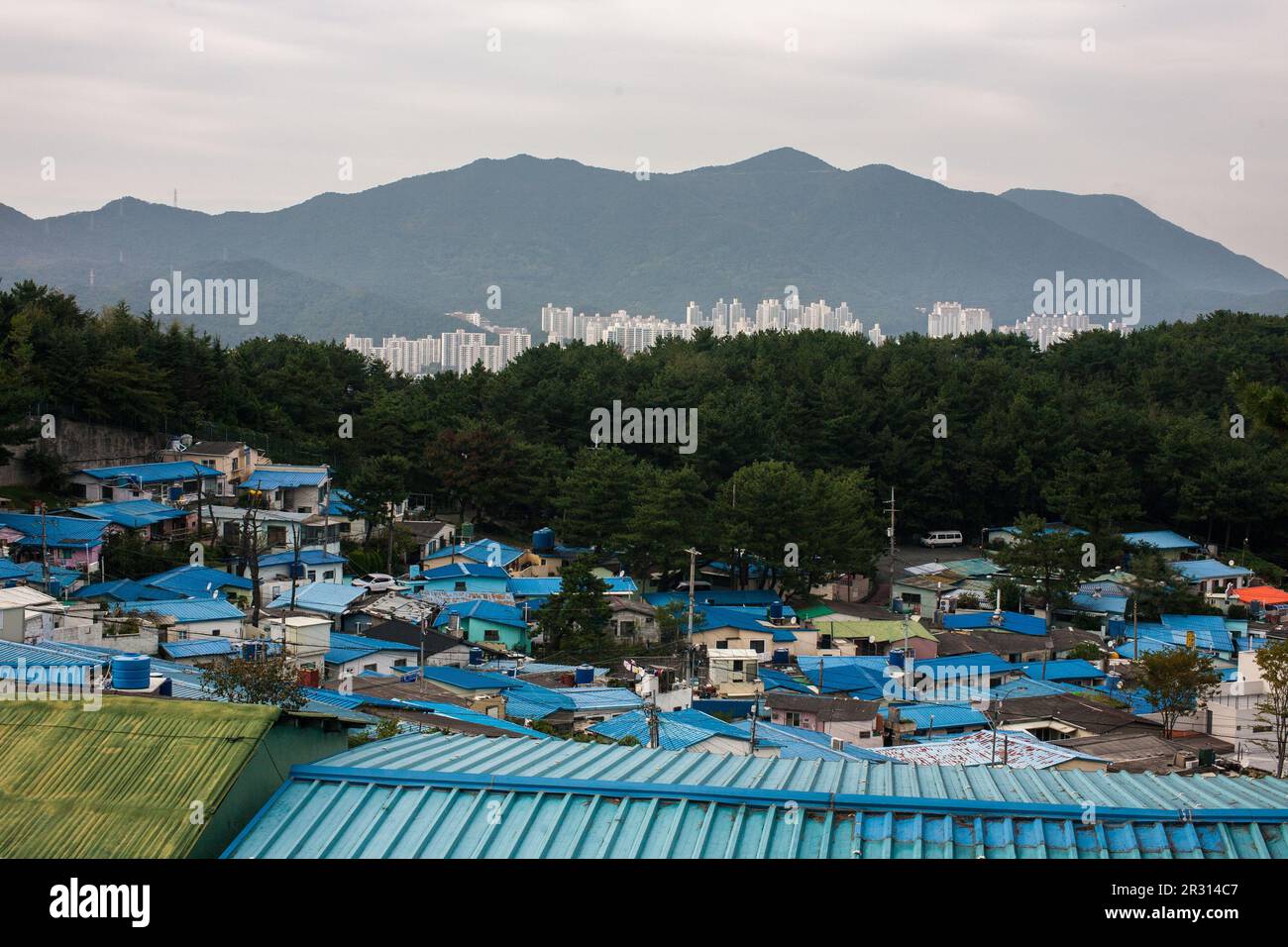 Blue-roofed poor hillside village and Apartment Stock Photo