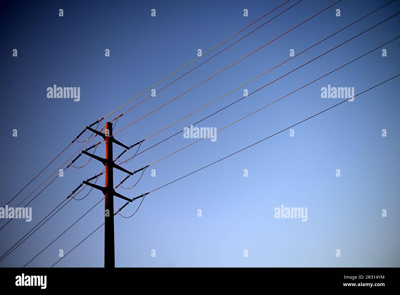 Electricity poles along the highway in Switzerland in bright sunshine Stock Photo