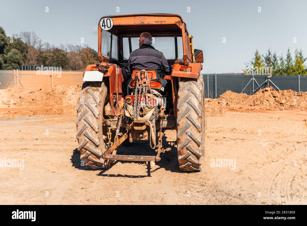 Senior Man Moving Earth With Tractor Stock Photo Alamy
