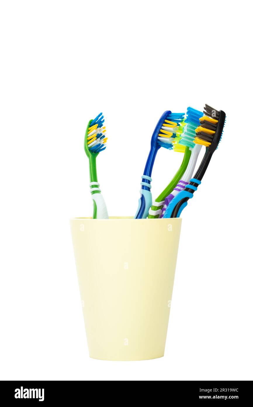 Toothbrush in a plastic cup on white background. Oral hygiene Stock ...