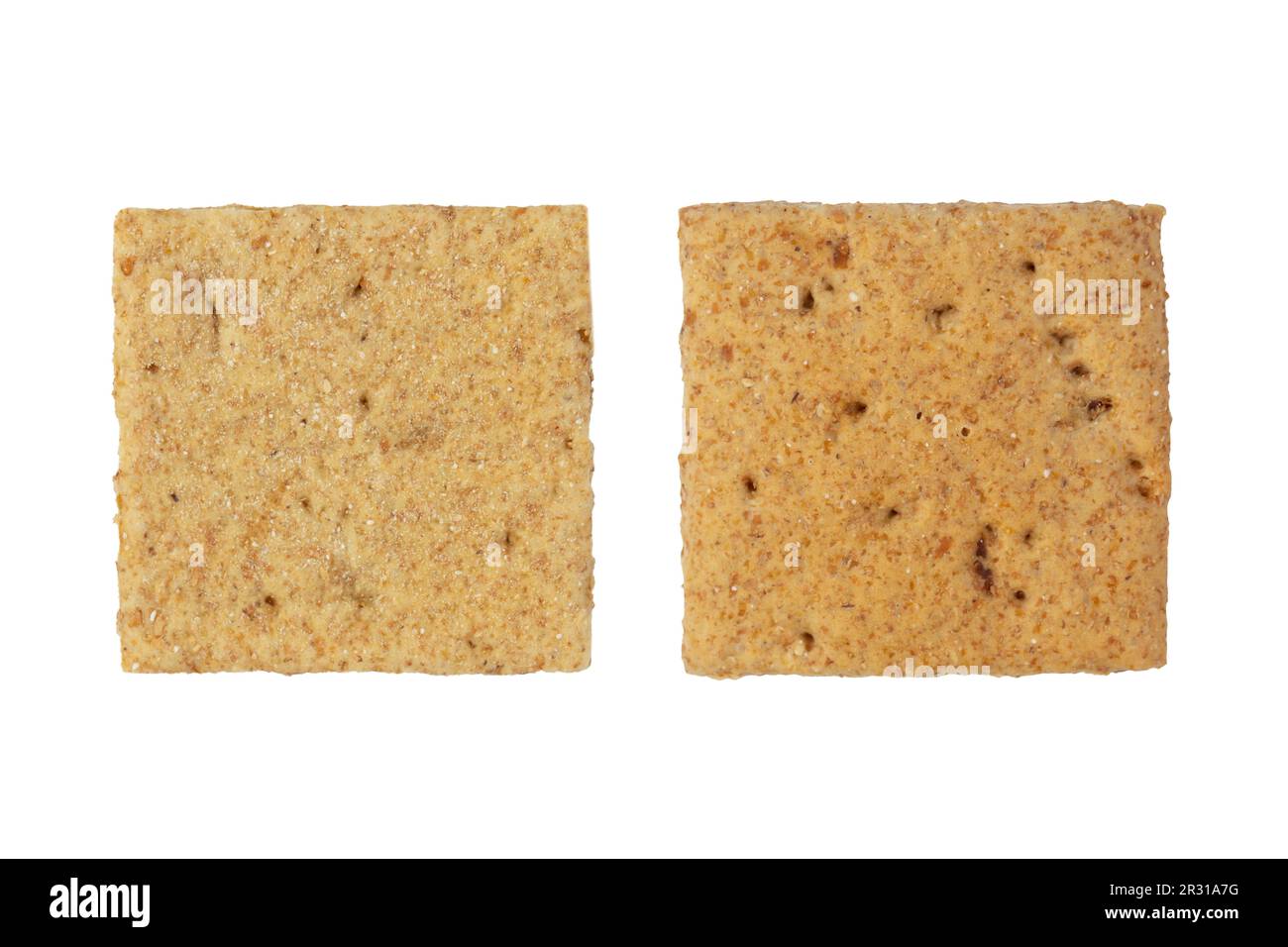 Two square crackers. Carbohydrate snack. Isolated on white background