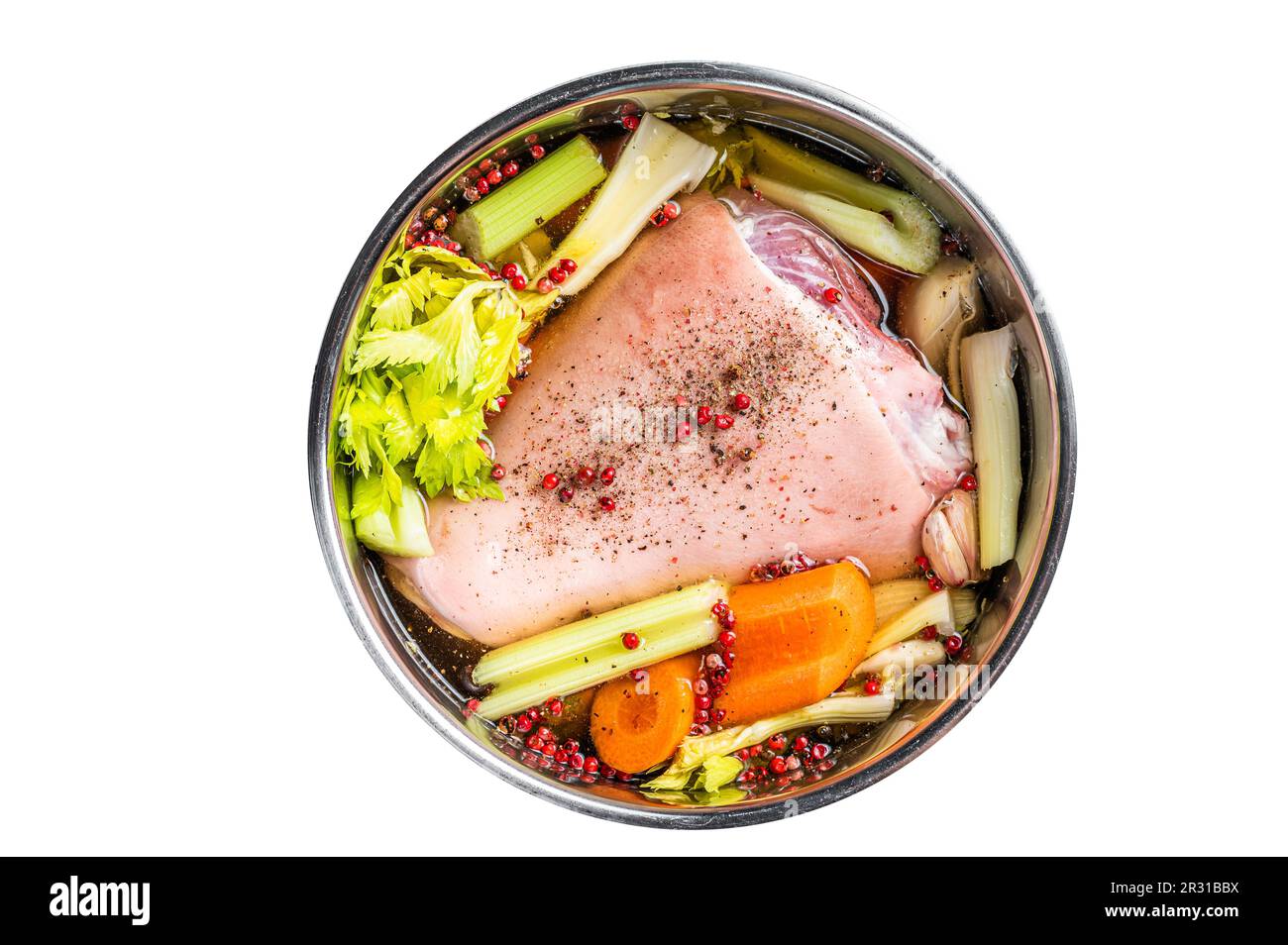 Cooking of Eisbein from Raw pork Hock ham, shank with vegetables and