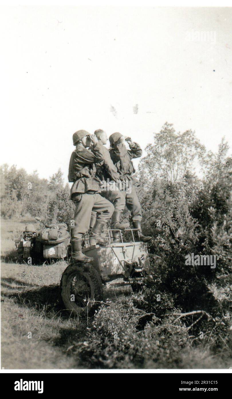 World War Two B&W photo German Soldiers in Camo Smocks from the Totenkopf Division watch for Russian Aircraft on the Russian Front 1941. Stock Photo