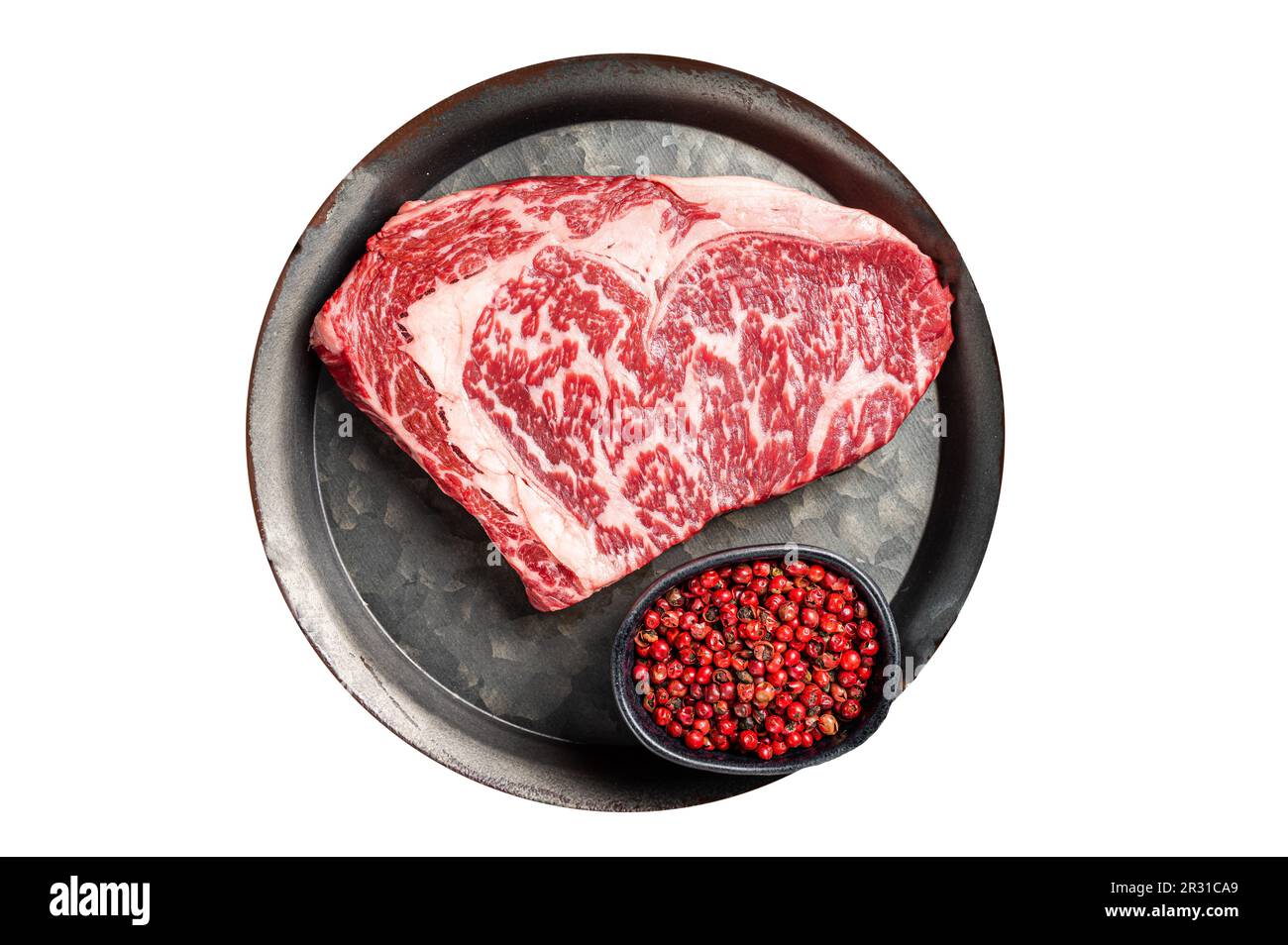 Raw wagyu rib eye beef meat steak in steel tray. Isolated on white