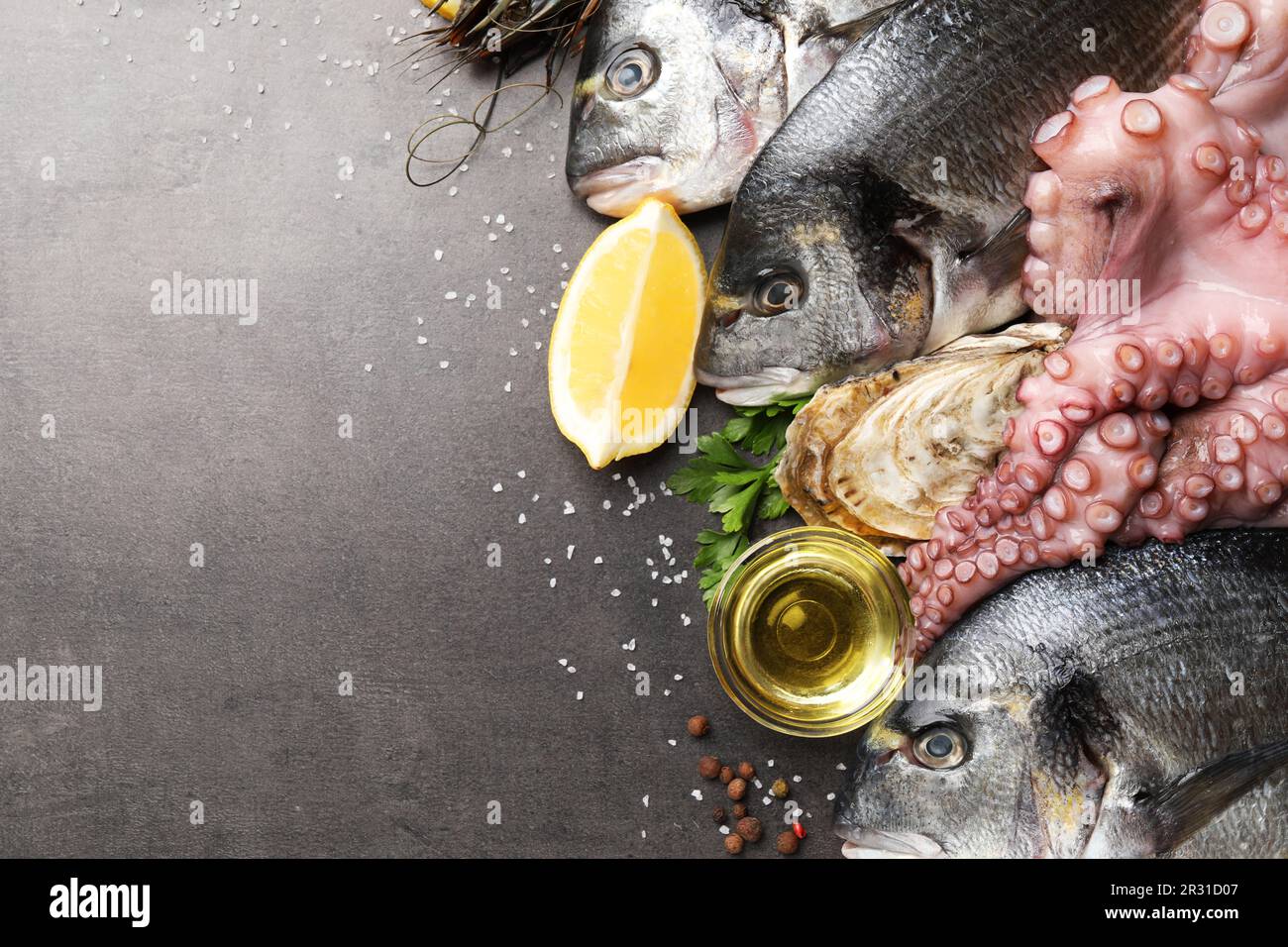 Flat lay composition with fresh raw dorado fish and different seafood ...