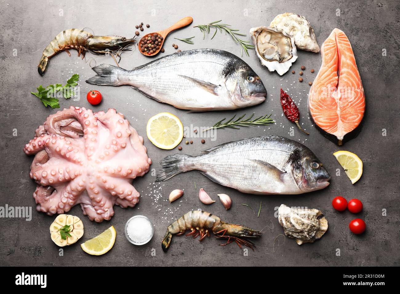Flat lay composition with fresh raw dorado fish and different seafood ...