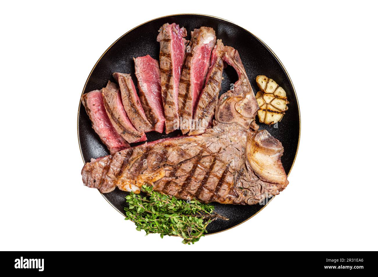 Grilled Medium rare Porterhouse, TBone Steak sliced in a plate