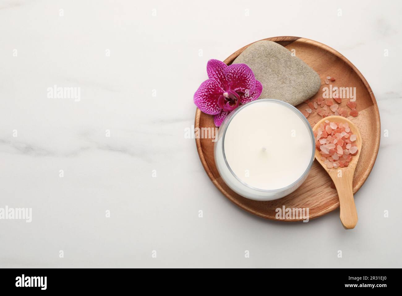 Flat lay composition with different spa products on white marble table ...