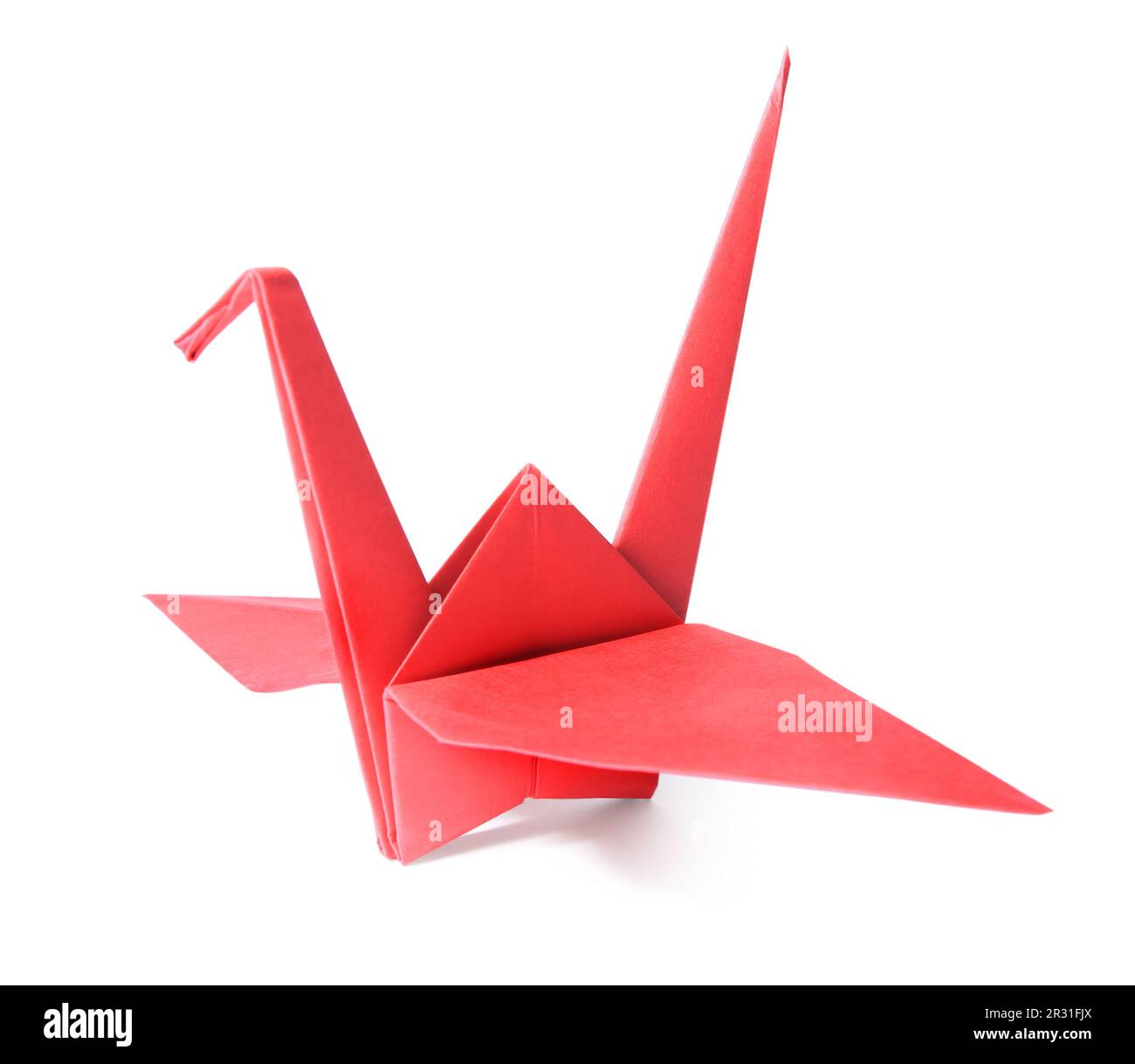 Origami art. Beautiful red paper crane isolated on white Stock Photo