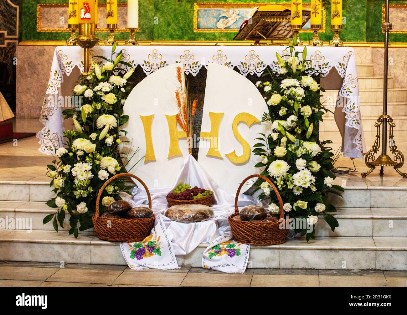 festive interior in the church with gifts from children for the first ...