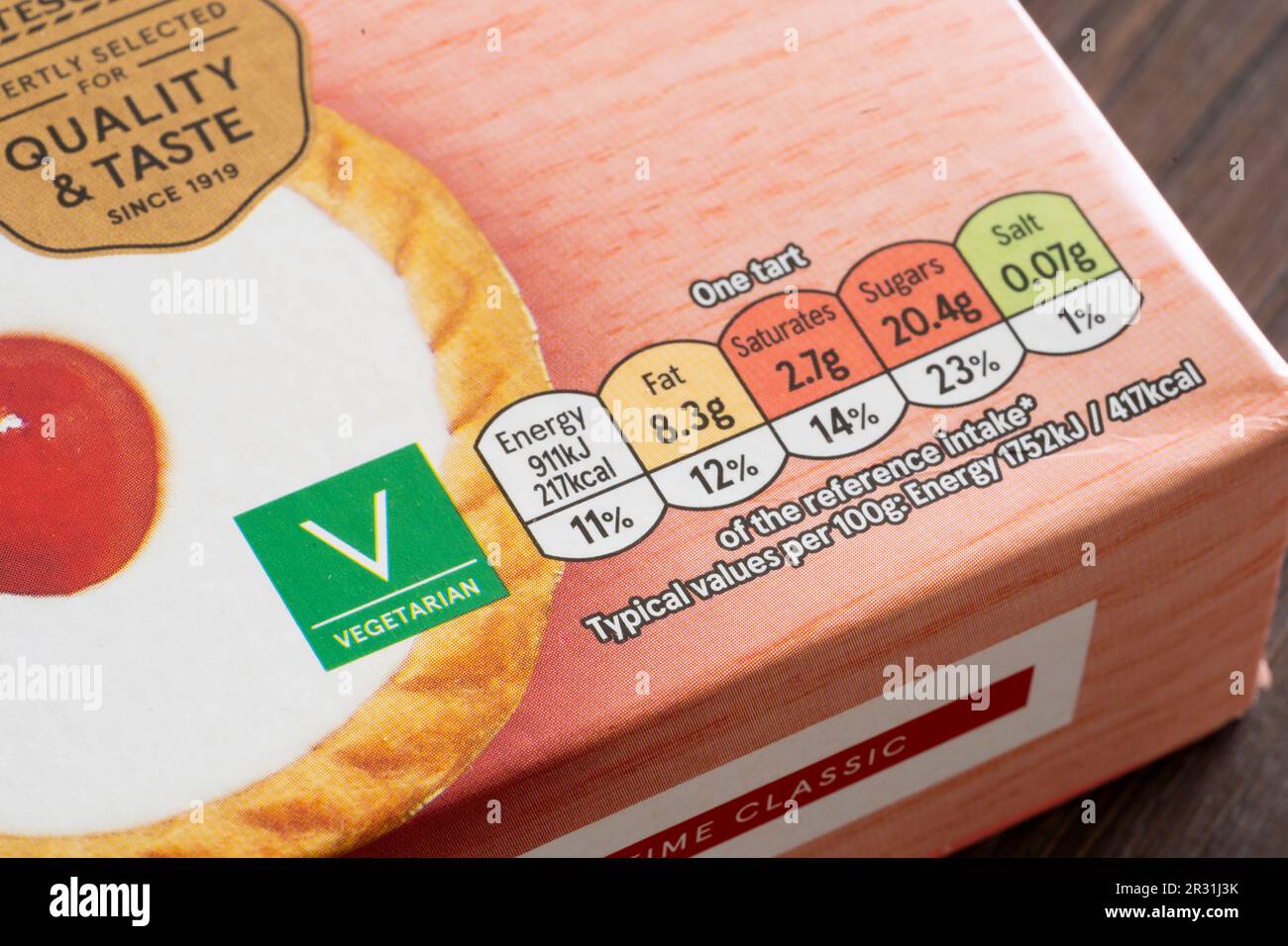 Front of pack food nutrition and vegetarian label on Tesco own brand cherry bakewell tarts, England. Concept: nutritional labellingm sugar content Stock Photo