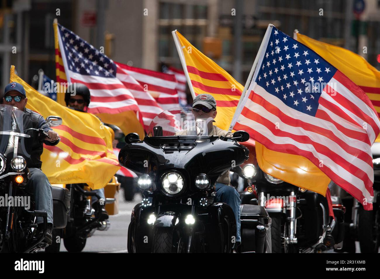 May 21, 2023, %G: (NEW) Motorcycle group with American and Vietnamese flags at the second annual AAPI Parade on Sixth Avenue (Avenue of the Americas). May 21, 2023. New York, USA The Asian American and Pacific Islander (AAPI) Cultural and Heritage Parade comes as New Yorkers celebrate Asian American Pacific Islander Heritage Month in May, as well as New York CityÃ¢â‚¬â„¢s being home to the second-largest Asian American and Pacific Islander population in the United States. AAPI Heritage Month pays tribute to the generations of Asian American and Pacific Islanders who have enriched New YorkÃ¢â‚¬ Stock Photo