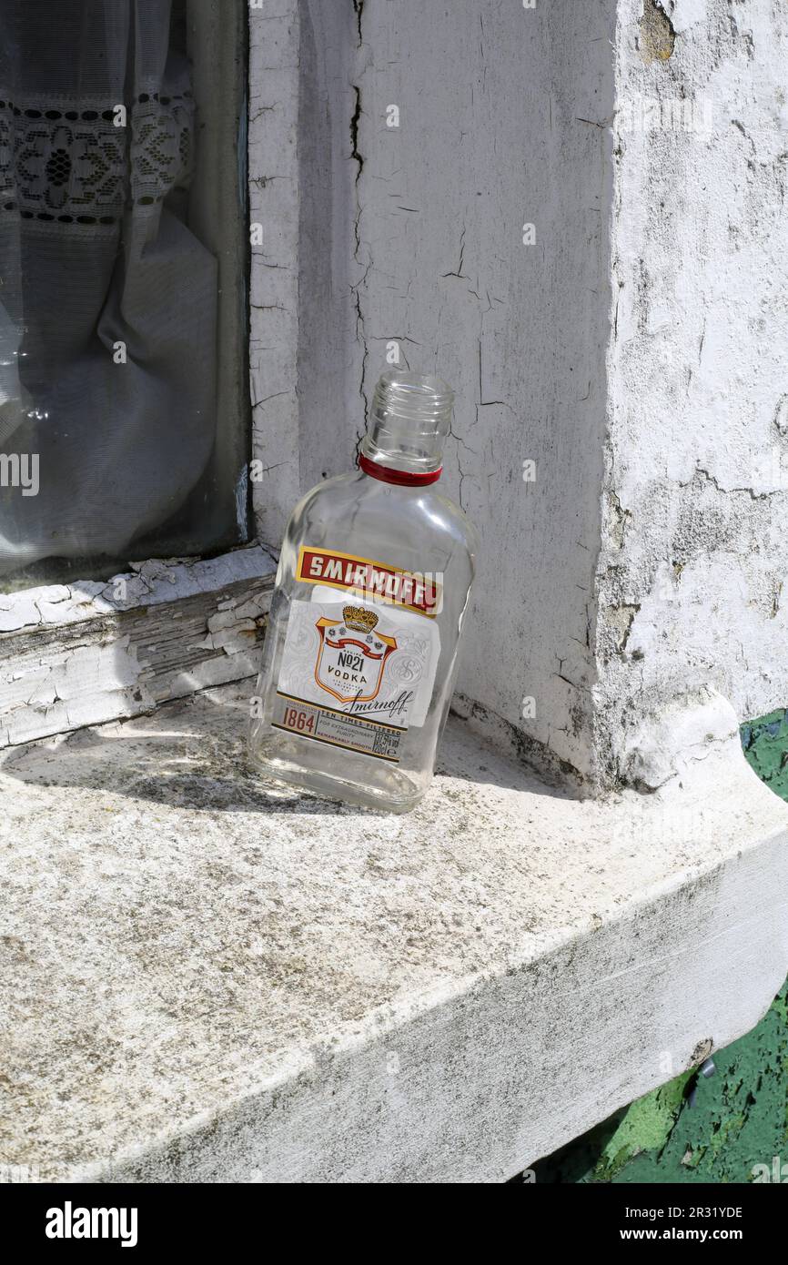 Vodka Empty An empty vodka bottle on a window ledge in Salisbury UK Stock Photo - Alamy