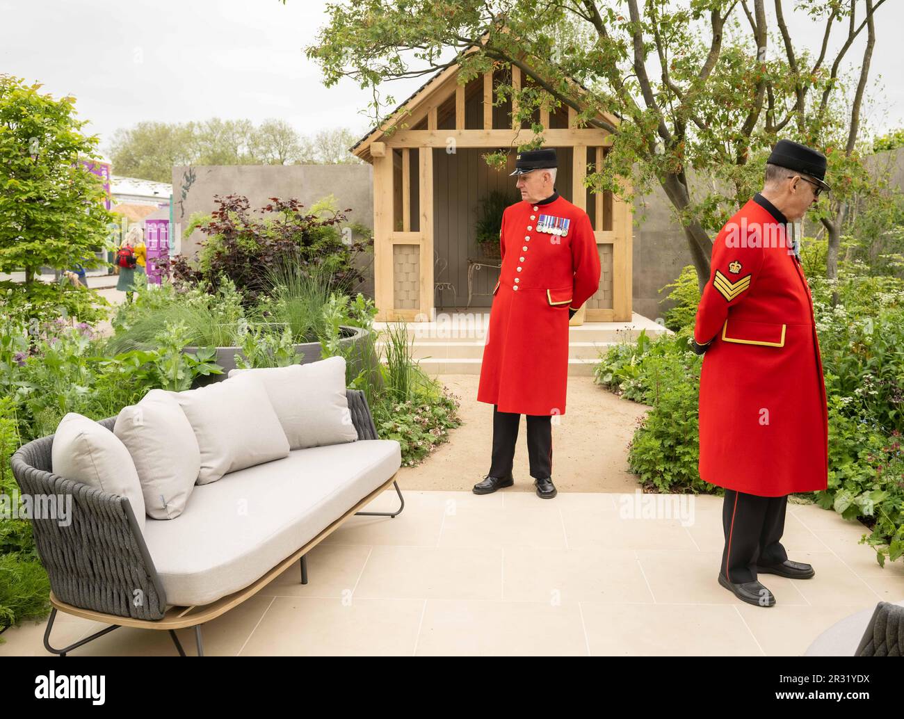 EDITORIAL USE ONLY Chelsea pensioners Norman Bareham (left) and William Rowlinson visit the RBC Brewin Dolphin garden designed by Paul Hervey-Brookes at RHS Chelsea Flower Show. Picture date: Monday May 22, 2023. The show garden inspired by a young couple who have taken lessons and knowledge from their grandparents to build a garden with 'longevity, diversity and habitat for the future'. Photo credit should read: John Nguyen/PA Wire Stock Photo