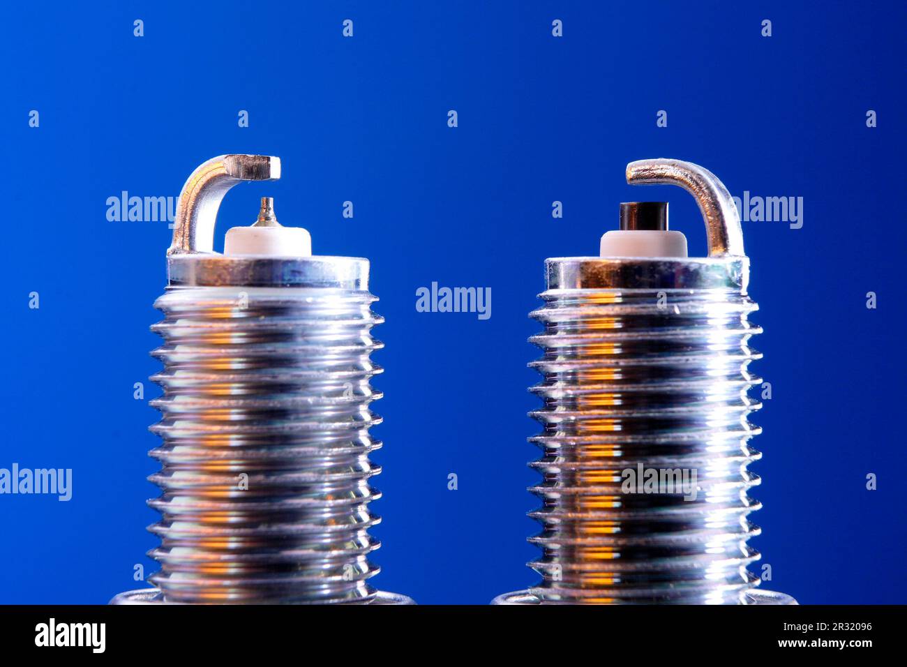 Iridium spark plug and standard compared Stock Photo Alamy