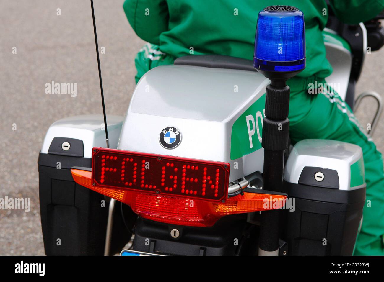 Piloce motorbike with sign follow me Stock Photo