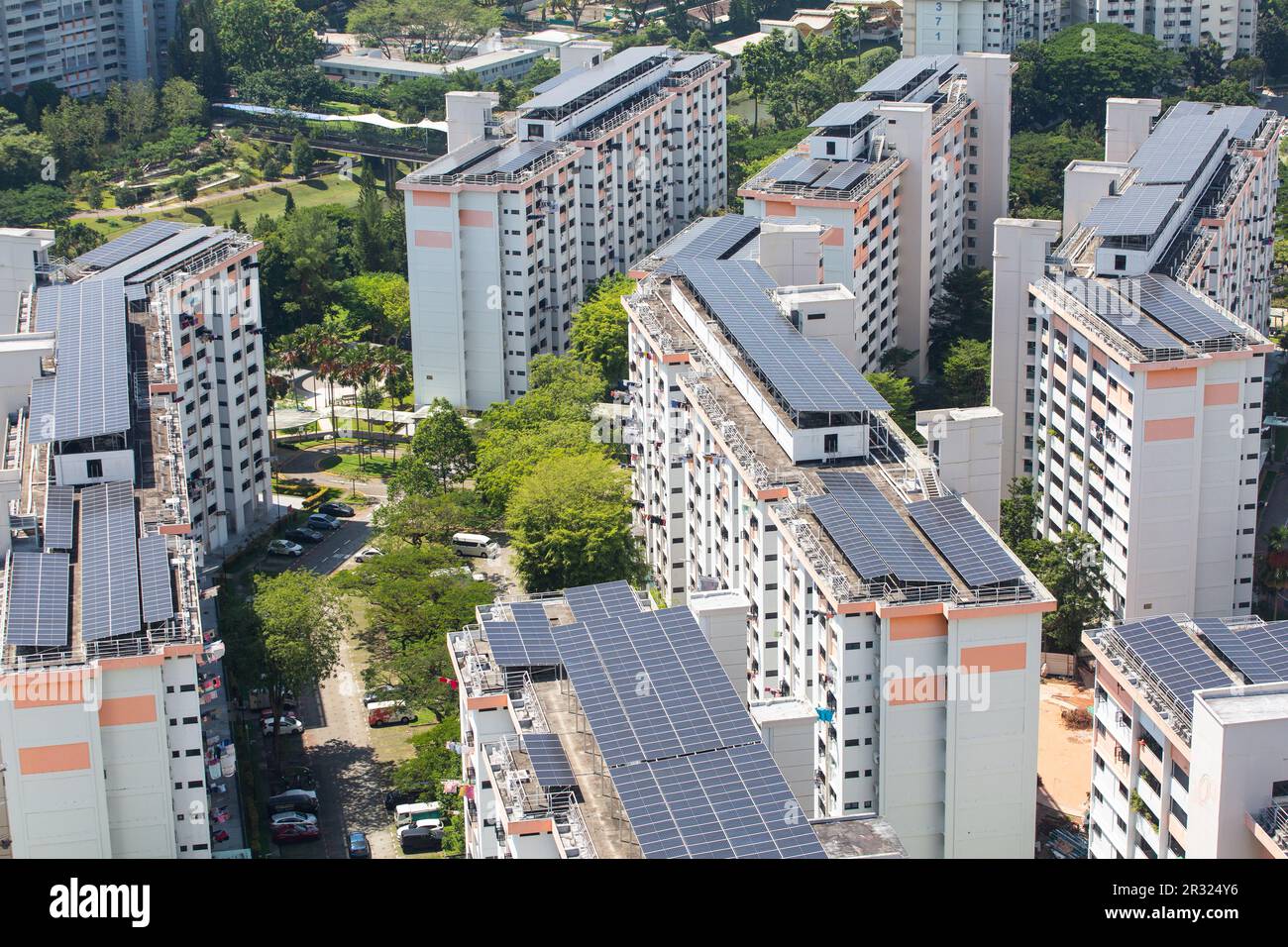 Solar panels are installed on top of HDB roof to convert sunlight into electricity for the household living in the building estate. Singapore Stock Photo