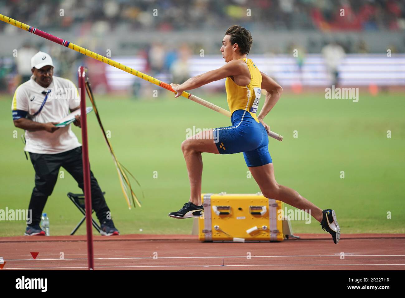 Armand Duplantis participating in the pole vault at the Doha 2019 World