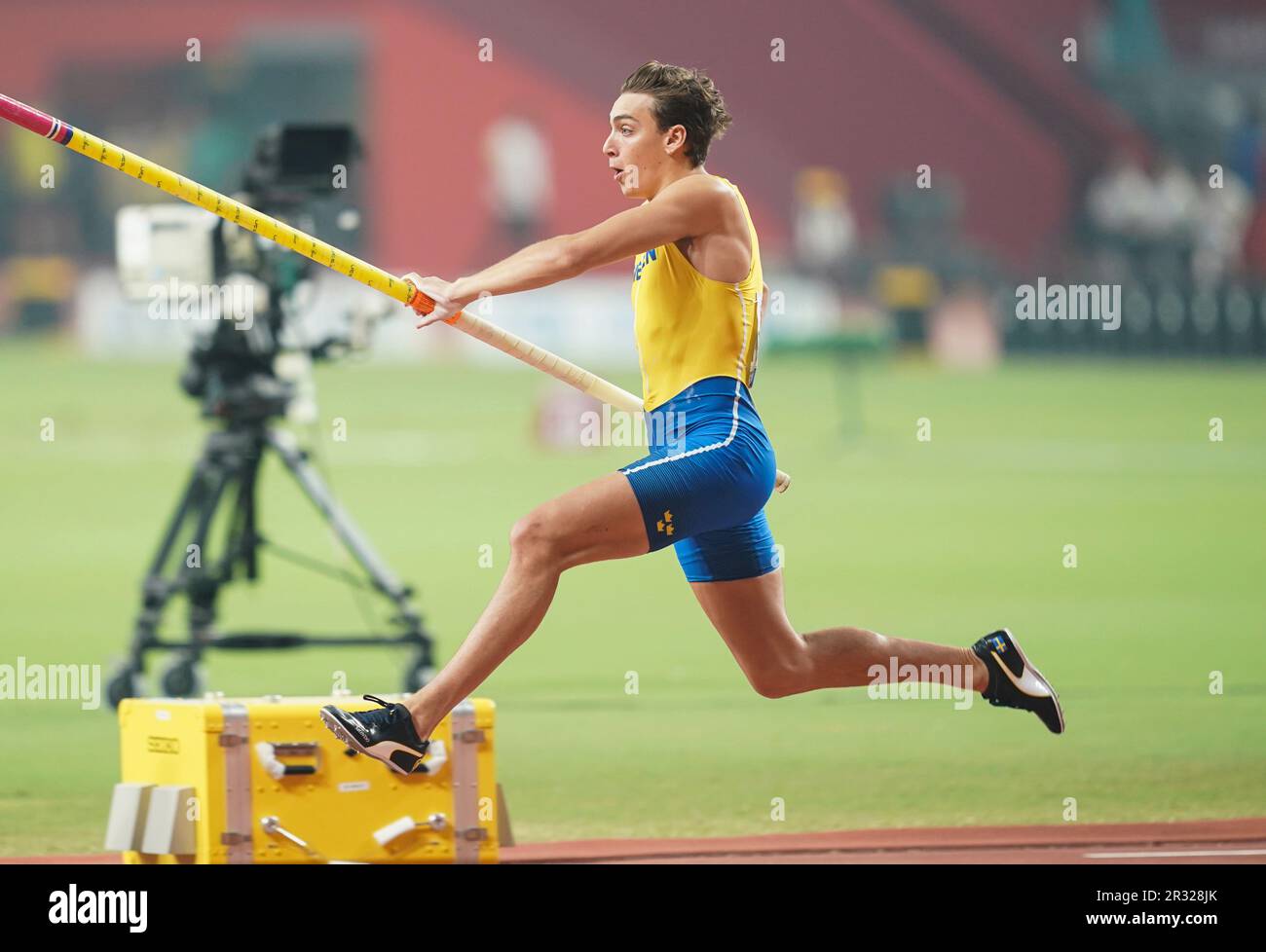 Armand Duplantis participating in the pole vault at the Doha 2019 World