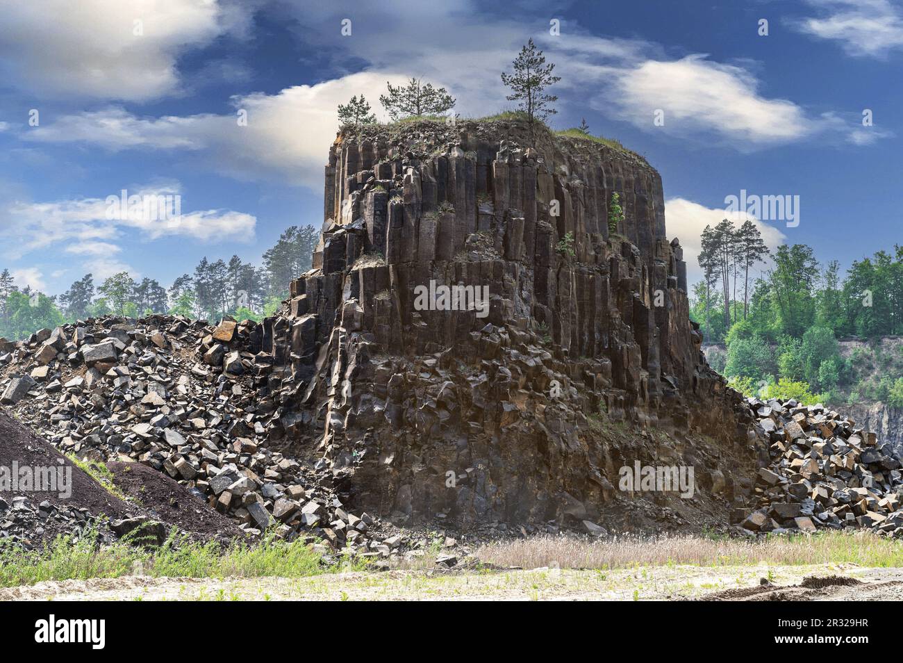 Basalt quarry. Columnar basalt quarry in summer. Volcanic stones