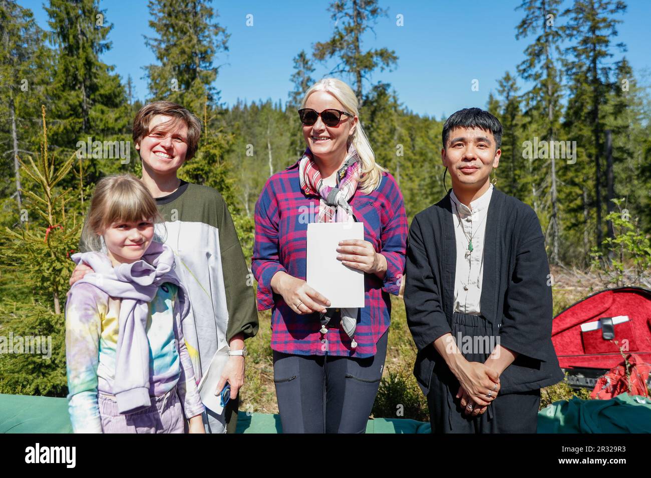Oslo 20230521.Crown Princess Mette-Marit visits the Future Library Forest in Nordmarka together with authors Judith Schalansky (left) and Ocean Vuong (right).  The Future Library project is a public artwork that aims to collect an original work by a popular writer every year for one hundred years. The project started in 2014 and the works will remain unread and unpublished until 2114. One thousand trees were planted at the beginning of the project and will be used for printing the books.  Photo: Frederik Ringnes / NTB Stock Photo