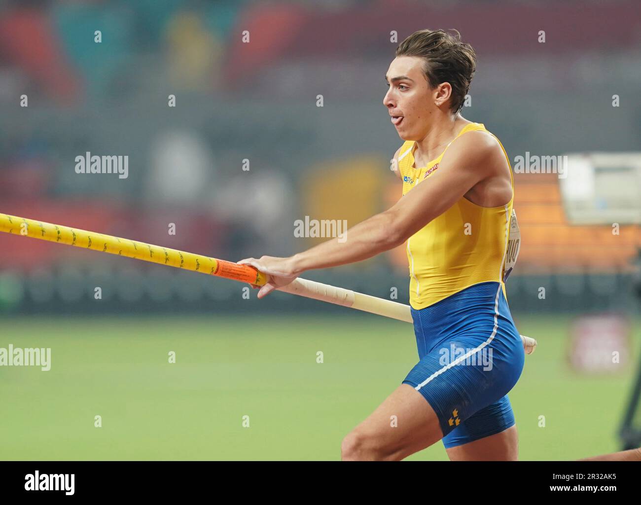 Armand Duplantis participating in the pole vault at the Doha 2019 World