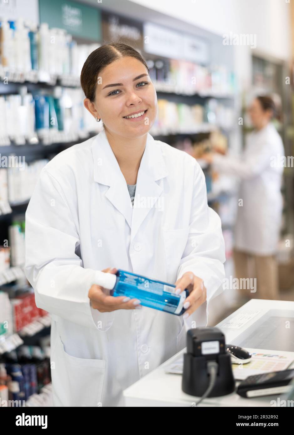 Caucasian woman pharmacist cashier counter hi-res stock photography and ...