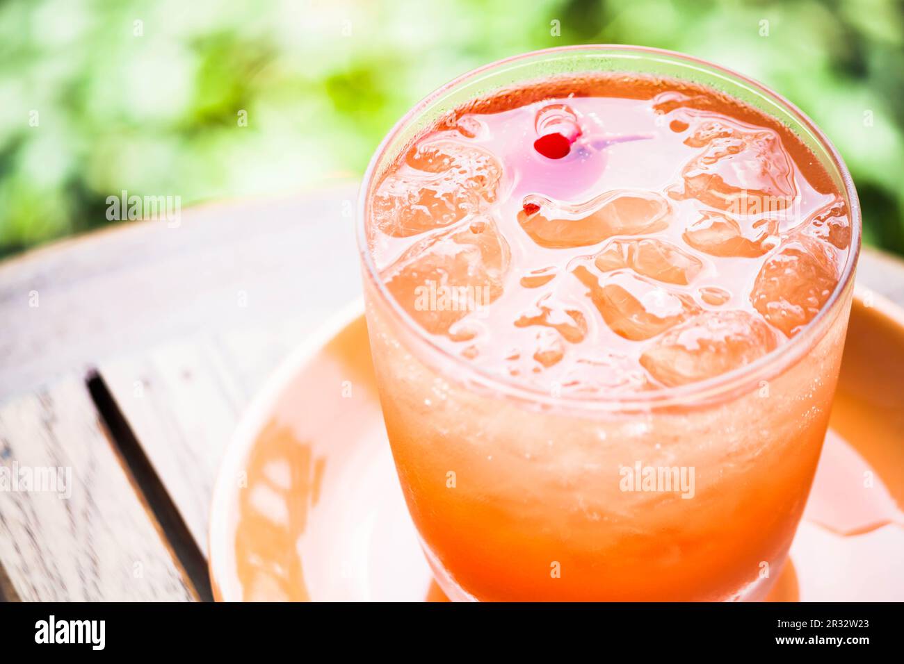 Glass of fresh cool soda with mix fruits juice Stock Photo Alamy