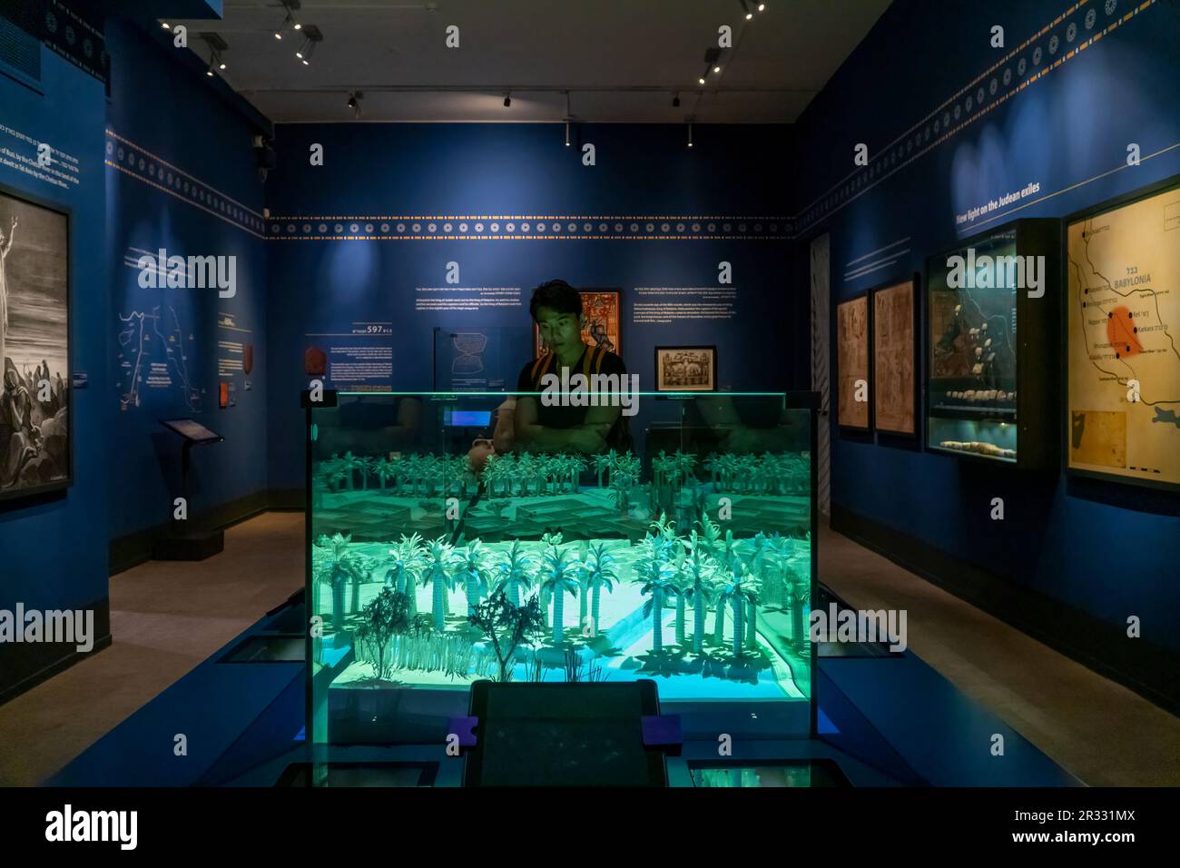 A tourist views an installation displayed in the archeological 